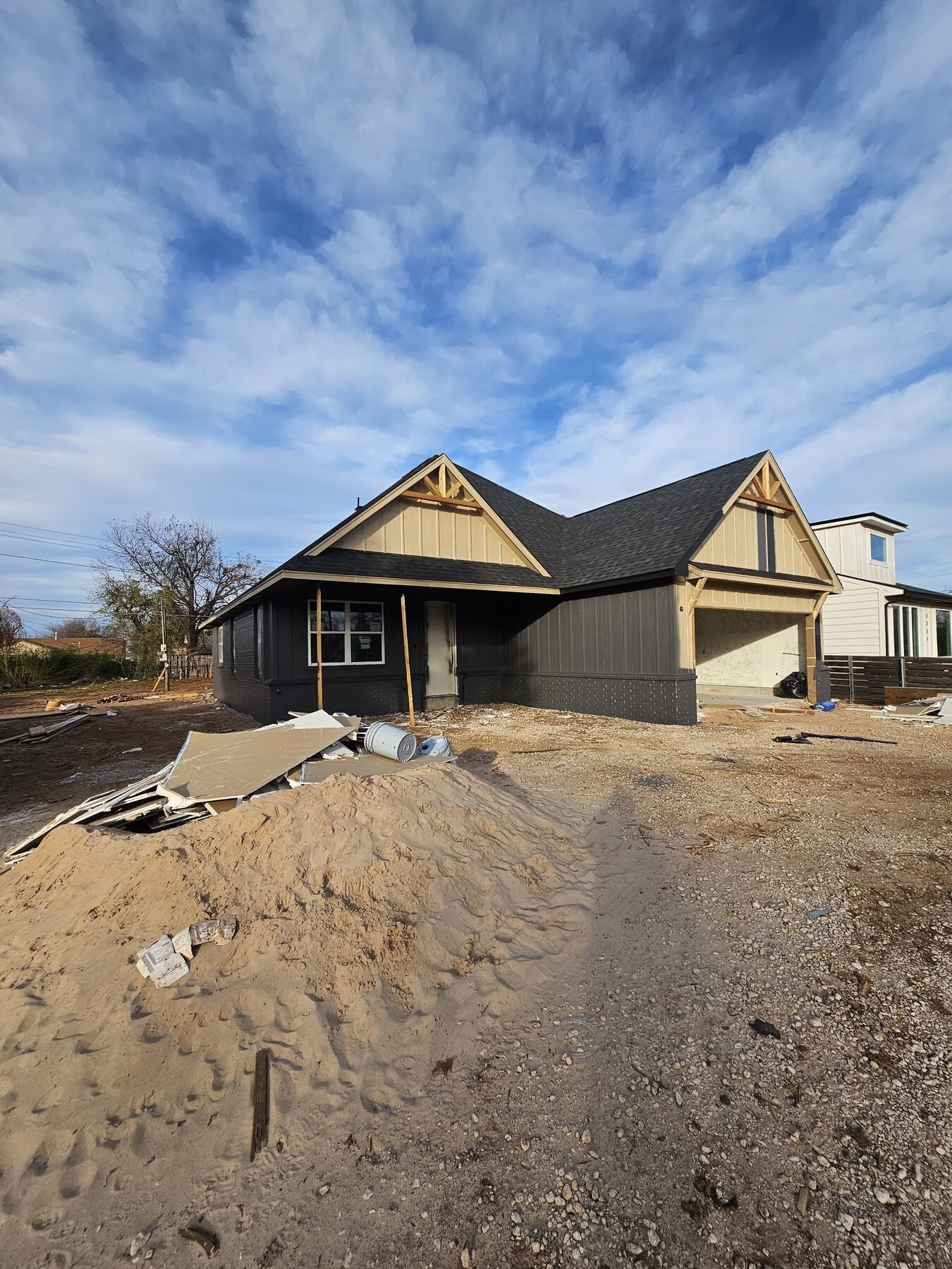 Framed new home and two-car garage during construction